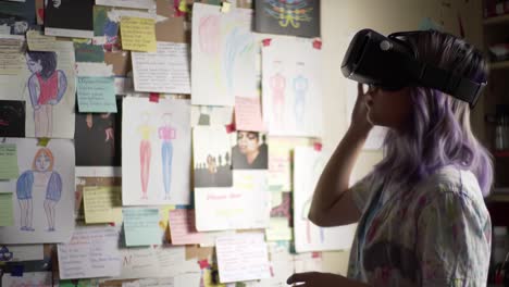a person engages with virtual reality while surrounded by sketches and notes on a wall. the setting reflects a creative atmosphere, highlighting artistic endeavors.