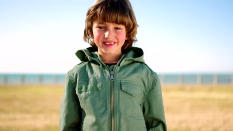 smile, freedom and face of a child at a park