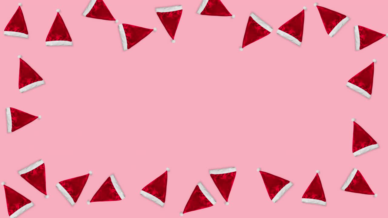 muchos sombreros rojos de santa claus flotando en un fondo rosa de navidad como un marco. animación de bucle sin costuras de un patrón con espacio de copia. concepto de vacaciones