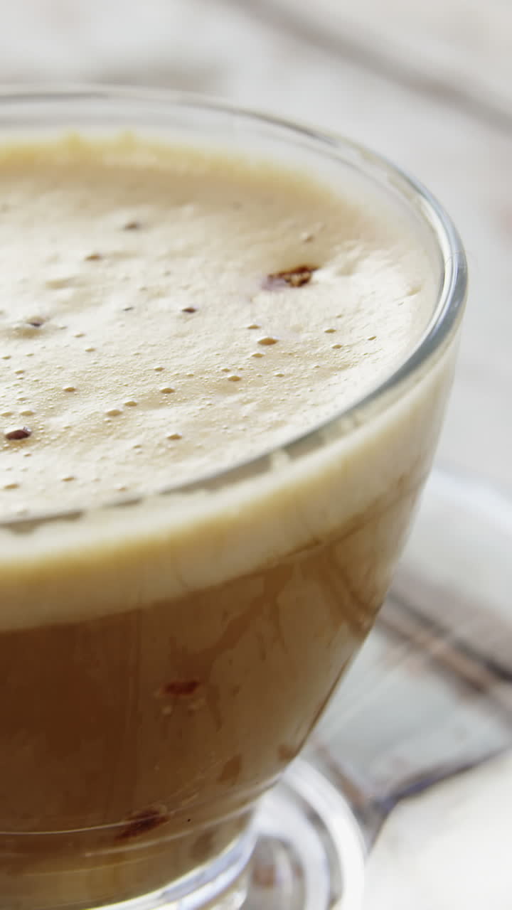 Coffee cup on wooden plank