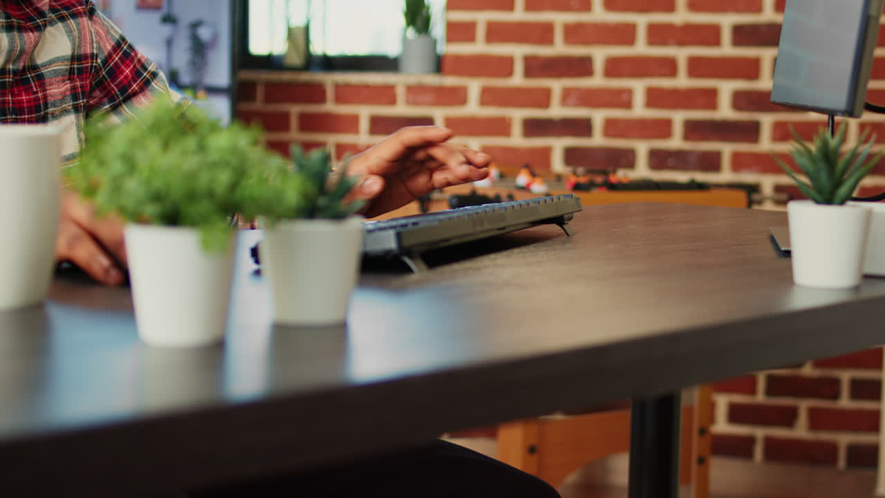 Typing on a keyboard at a desk