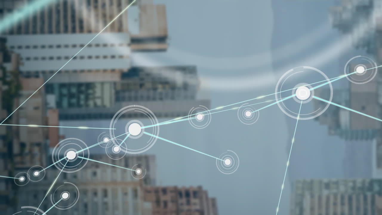 Graphic designer using urban network overlay technology, showing glowing nodes and light blue lines