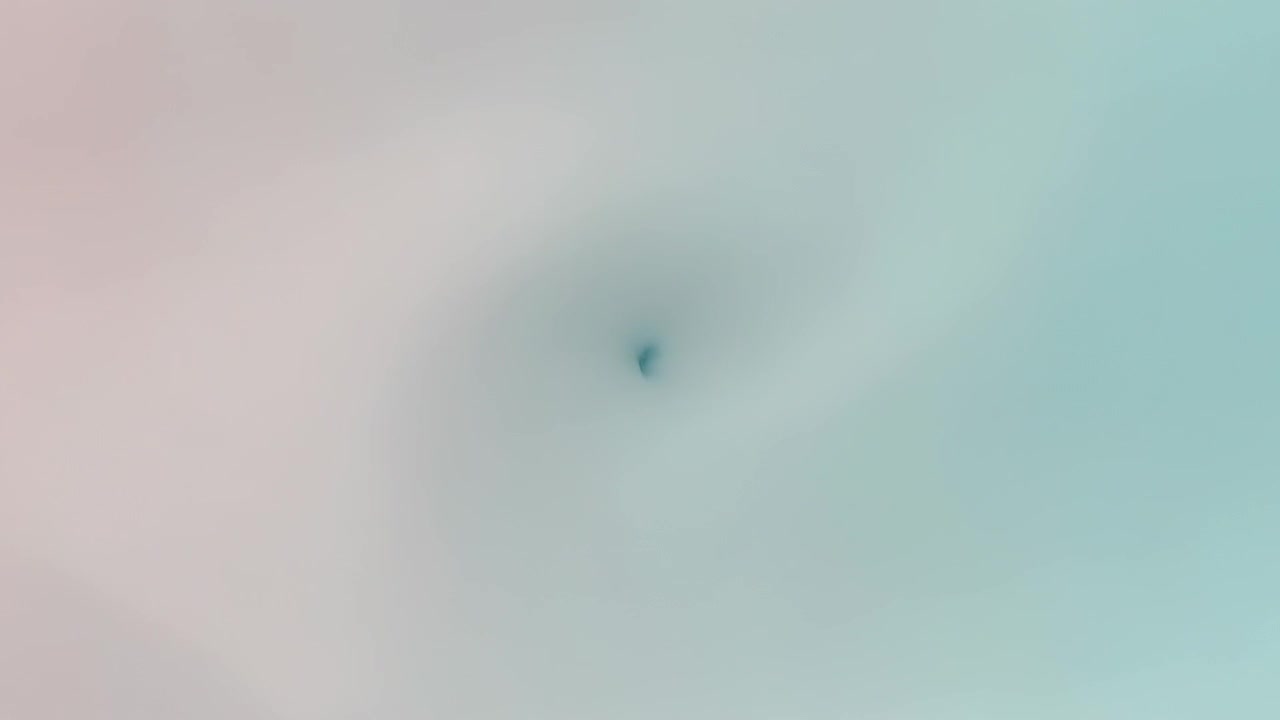 Speck appearing in pastel field, forming tiny core vortex, drawing pink-cyan inward, calming blur