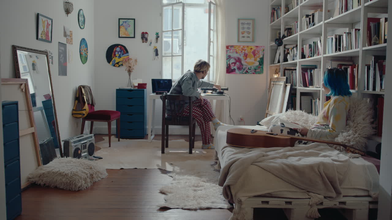 Man Speaking with Girlfriend before Recording Music at Home