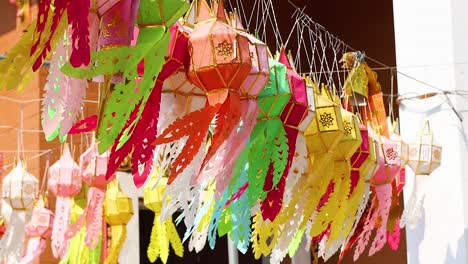 vibrant lanterns moving in a breeze outdoors