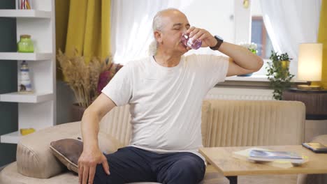 the sick old man drinks a lot of water.