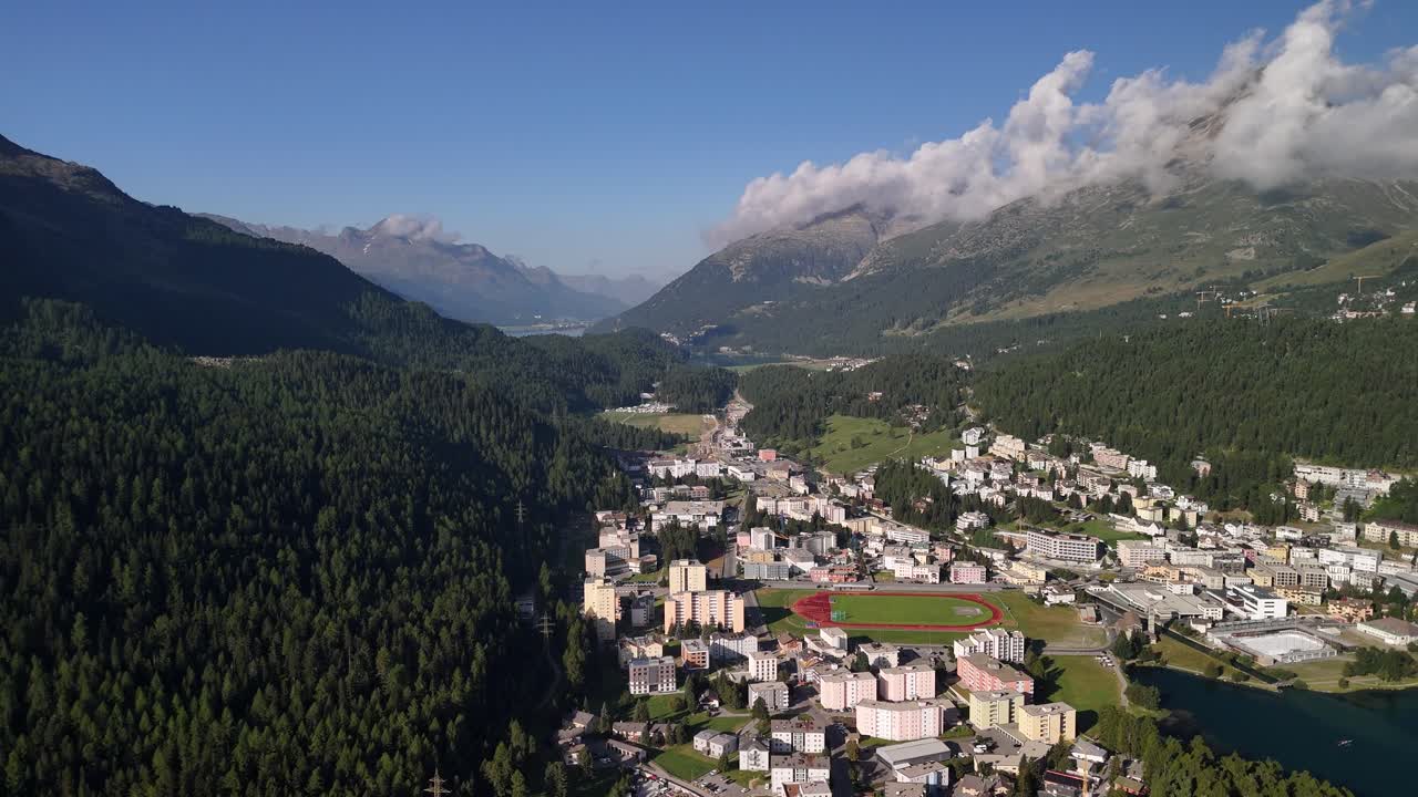 Backward shot of the city of St. Moritz and St. Moritzersee Lake, Switzerland