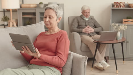 elderly couple using technology at home