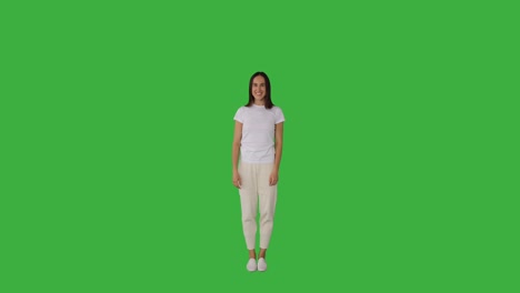 surprise woman celebrating success over green background