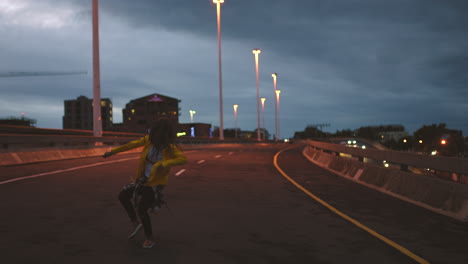 black woman dancing, filming video content