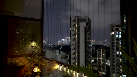 residential apartment buildings, static view from inside apartment building window in singapore