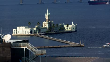 historic ilha fiscal island customs building, static shot of slow boat leaving guanabara bay rio de janeiro