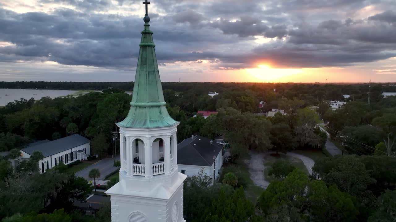 aerial push in past church steeple at sunset in beaufort sc, south carolina