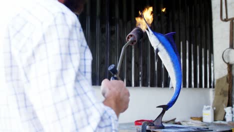 craftsman preparing fish sculpture 4k