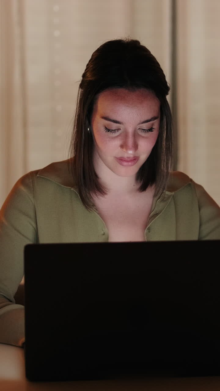 Portrait of CWoman Working From Home on Laptop at Night