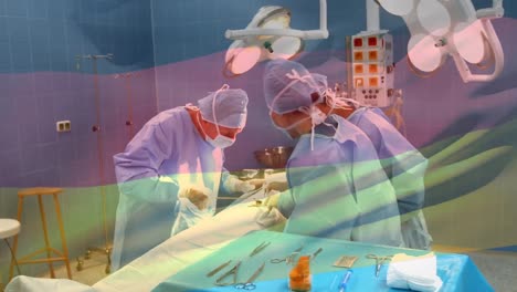 Animation-of-flag-of-germany-waving-over-surgeons-in-operating-theatre