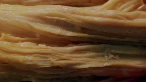 fermented soy food fuzhou, tofu skin yuba sticks or fuzhu on plate. healthy asian soy food, korean and chinese cuisine.