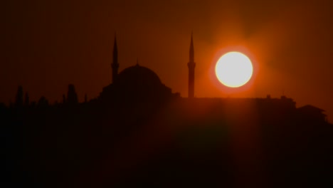 beautiful sunset behind a mosque in istanbul turkey