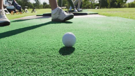 Low-section-of-senior-man-practicing-golf-at-golf-course-on-a-bright-sunny-day