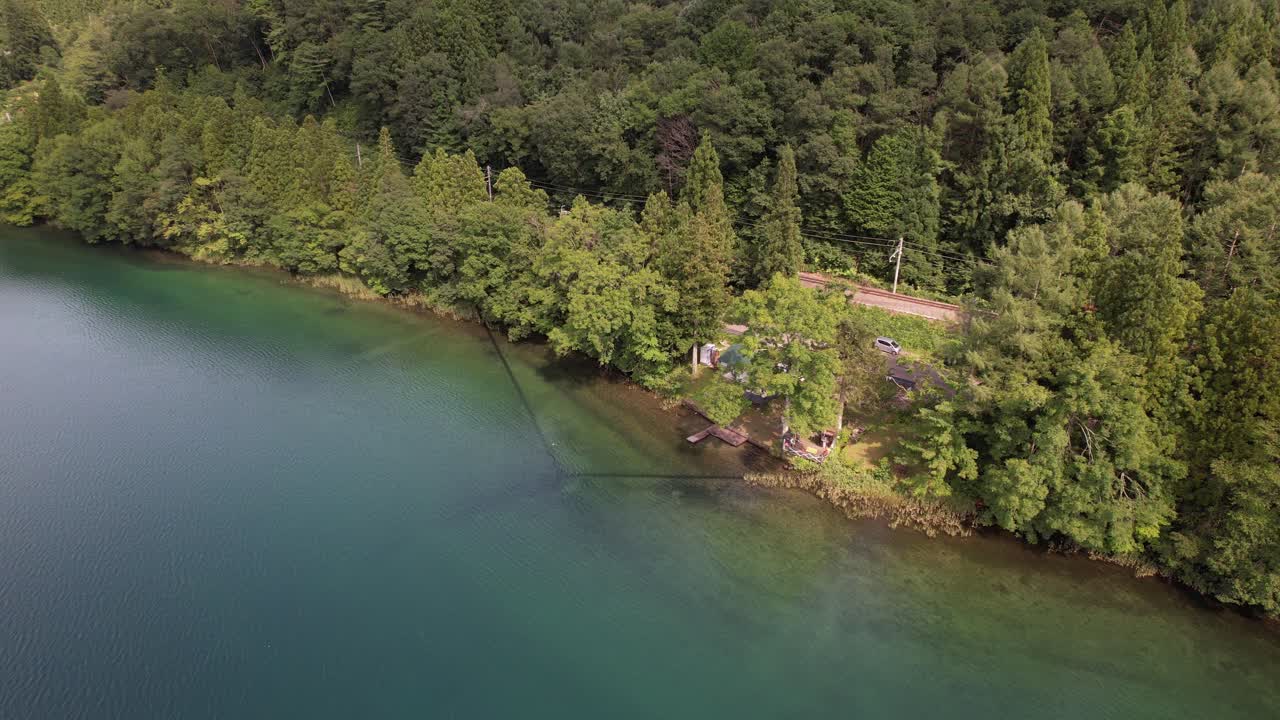 Aerial View of a Tranquil Lake Surrounded by Forest