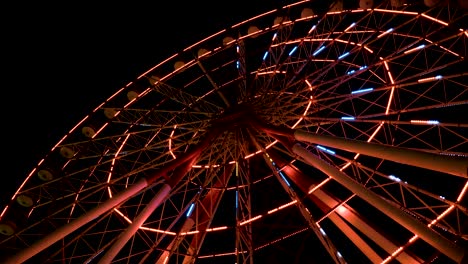 ferris wheel at night in the city batumi, georgia