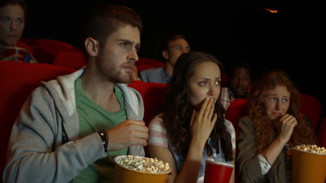 friends watching movie in cinema