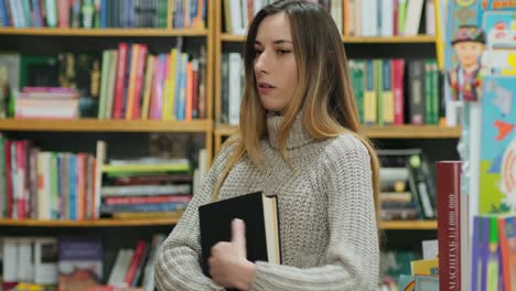 girl looks for information in the book and is disappointed