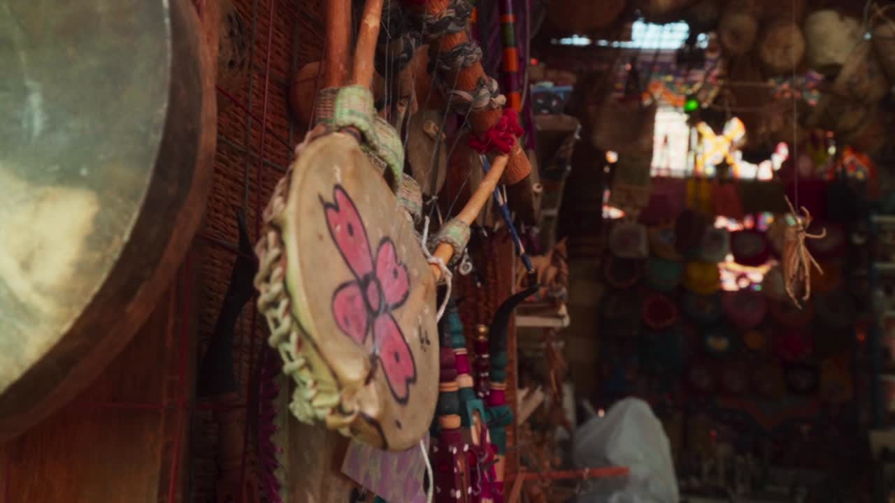 Traditional Egyptian string instrument hanging on display in a bazaar, Luxor Egypt. 
Slow rotational movement.