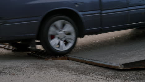 cars driving on the ramp of ferry boat in thailand, close up