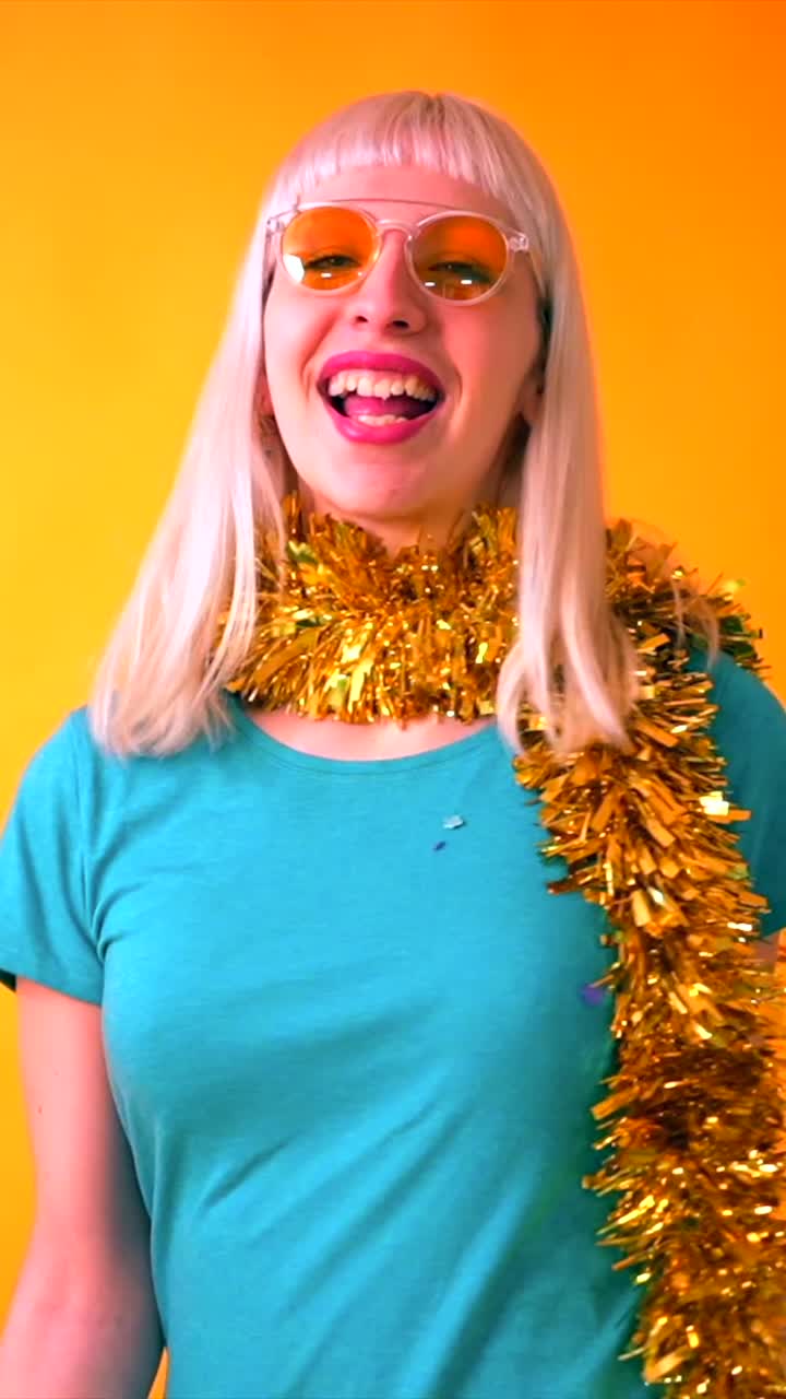 Woman celebrating with confetti and tinsel