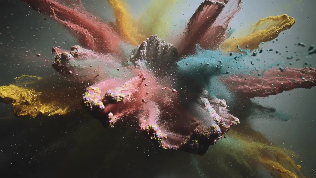 Meeting teal and pink pigment jets creating expanding cloud in studio, with dust fanning out