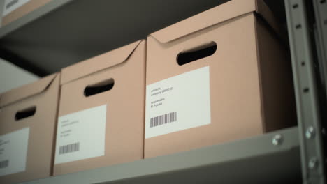 organized file boxes on metal shelves