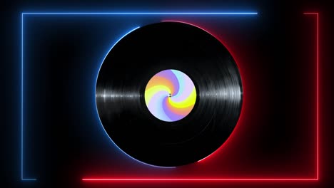 línea de neón brillante y disco de vinilo con pegatina de colores girando sobre fondo negro.