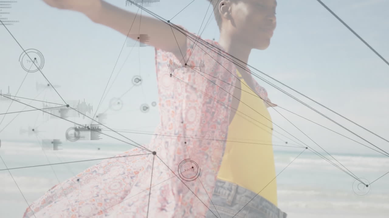 Female standing on beach with arms outstretched, using digital network graphs for technology
