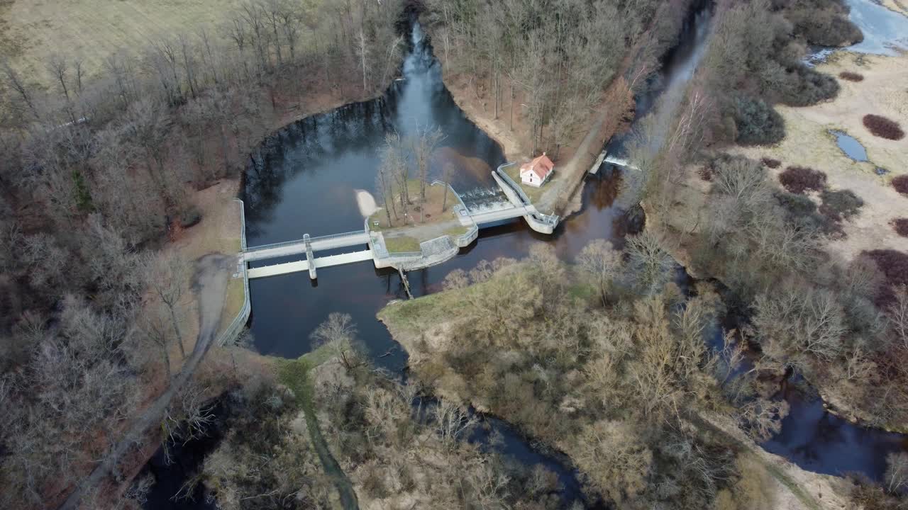 Confluence of rivers with dam and control building