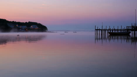 sunrise over a foggy coastal village