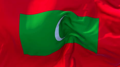 maldives flag waving in wind slow motion animation . 4k realistic fabric texture flag smooth blowing on a windy day continuous seamless loop background.