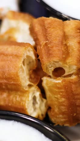 delicious fried dough sticks with creamy soup