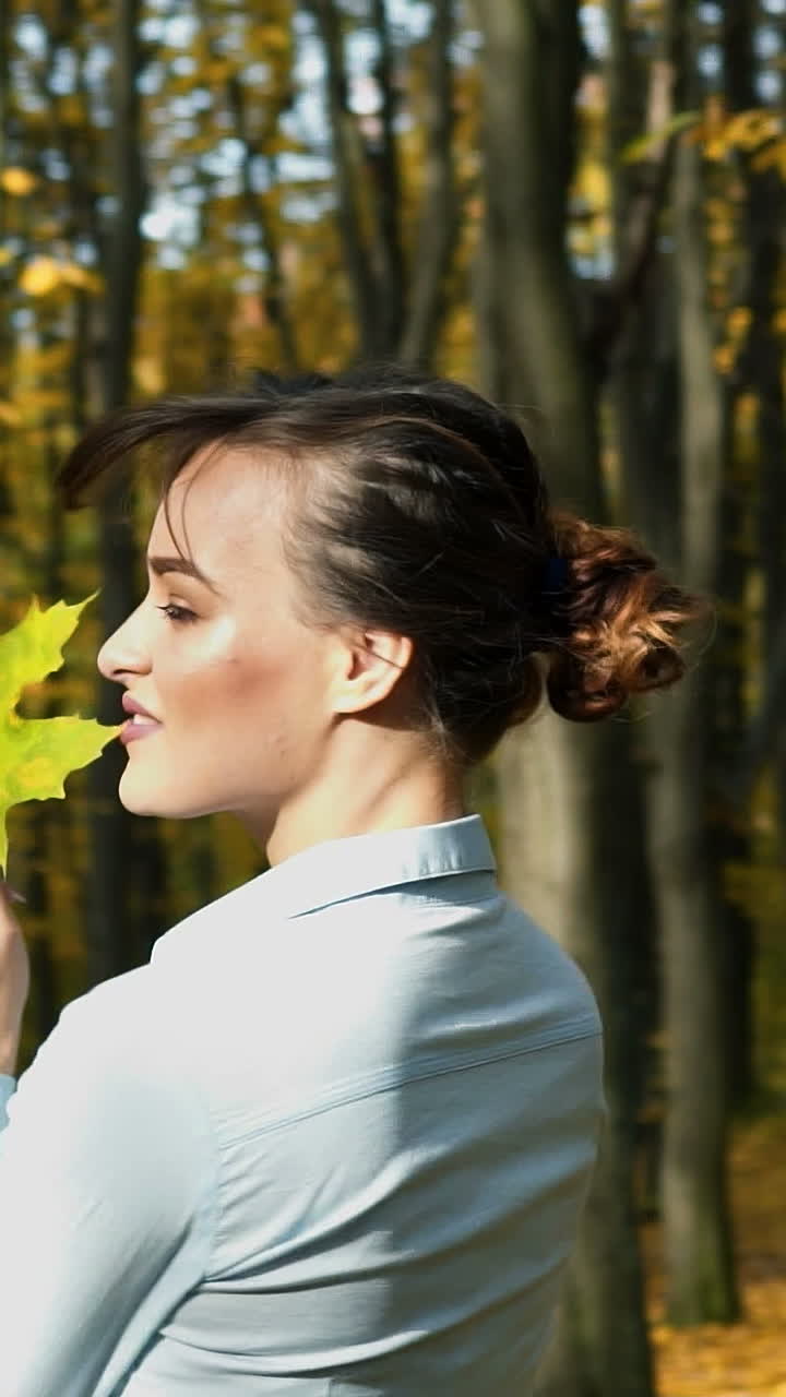 Elegant woman walking in a park. Beautiful elegant woman walking in a park in autumn , Fall concept