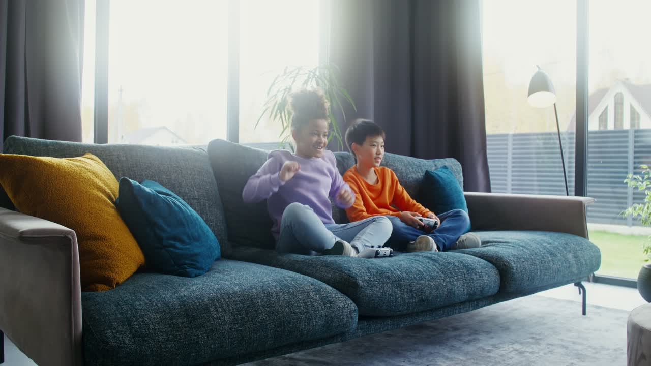 Kids Playing Video Games on Couch