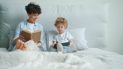 mother and son relaxing in bed