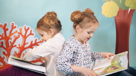 children girlfriends reading book education togetherness studio portrait