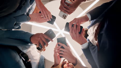 group of people using cell phones together