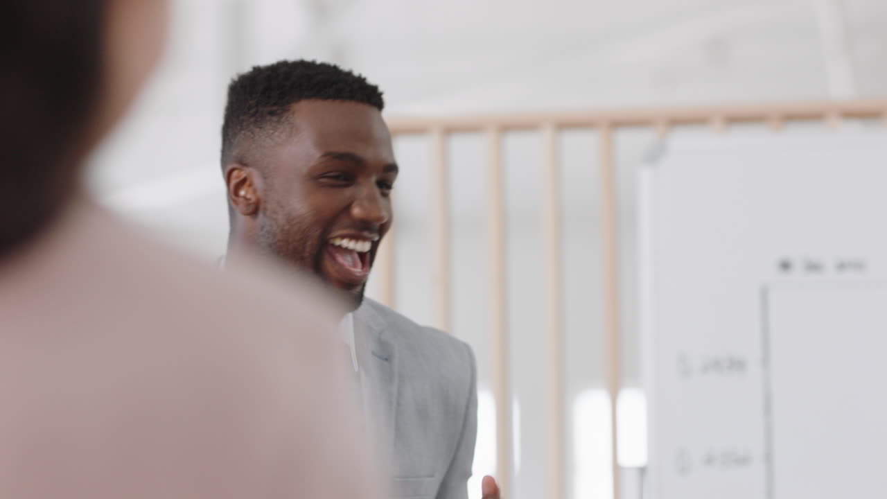 happy business people celebrating success in boardroom meeting enjoying corporate victory colleagues high five in office presentation