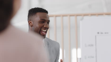 happy-business-people-celebrating-success-in-boardroom-meeting-enjoying-corporate-victory-colleagues-high-five-in-office-presentation