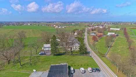 An-Aerial-View-of-Rural-America-of-Amish-Farmlands-With-Amish-Crops-on-a-Sunny-Spring-Day