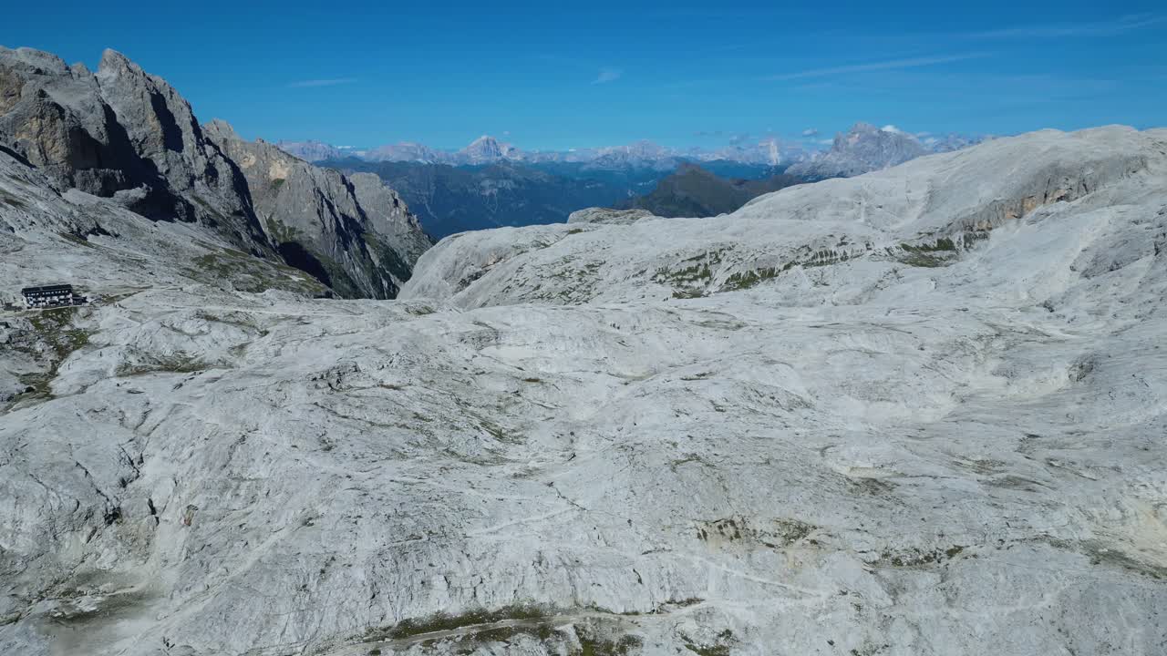 Drone footage of the Pale di San Martino in the Dolomites, Italy: majestic peaks, rocky spires, alpine meadows, and dramatic landscapes ideal for travel, nature, and adventure projects