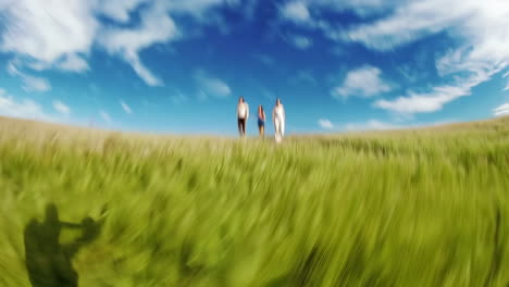 dynamic wide-angle view of people walking on a vibrant green hill