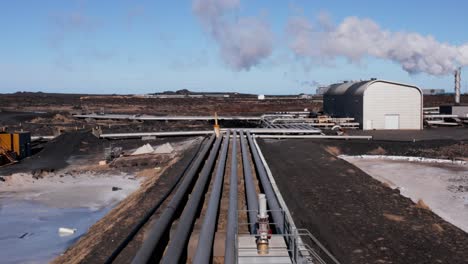 geothermal pipeline at renewable energy power plant in iceland, aerial