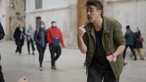 street magician performing a card trick